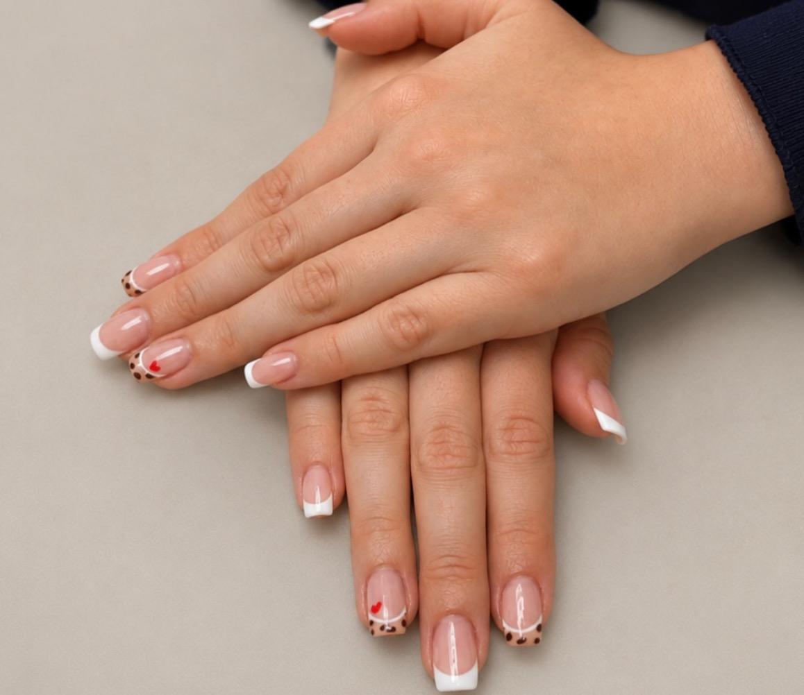 French tip nails with leopard print and heart accent nails