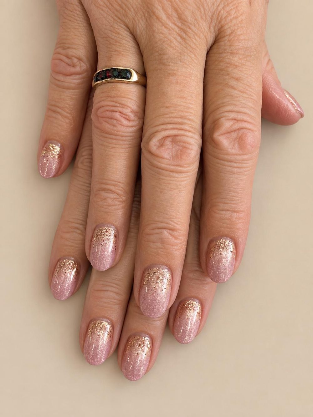 Oval nails with a rose gold glitter fade
