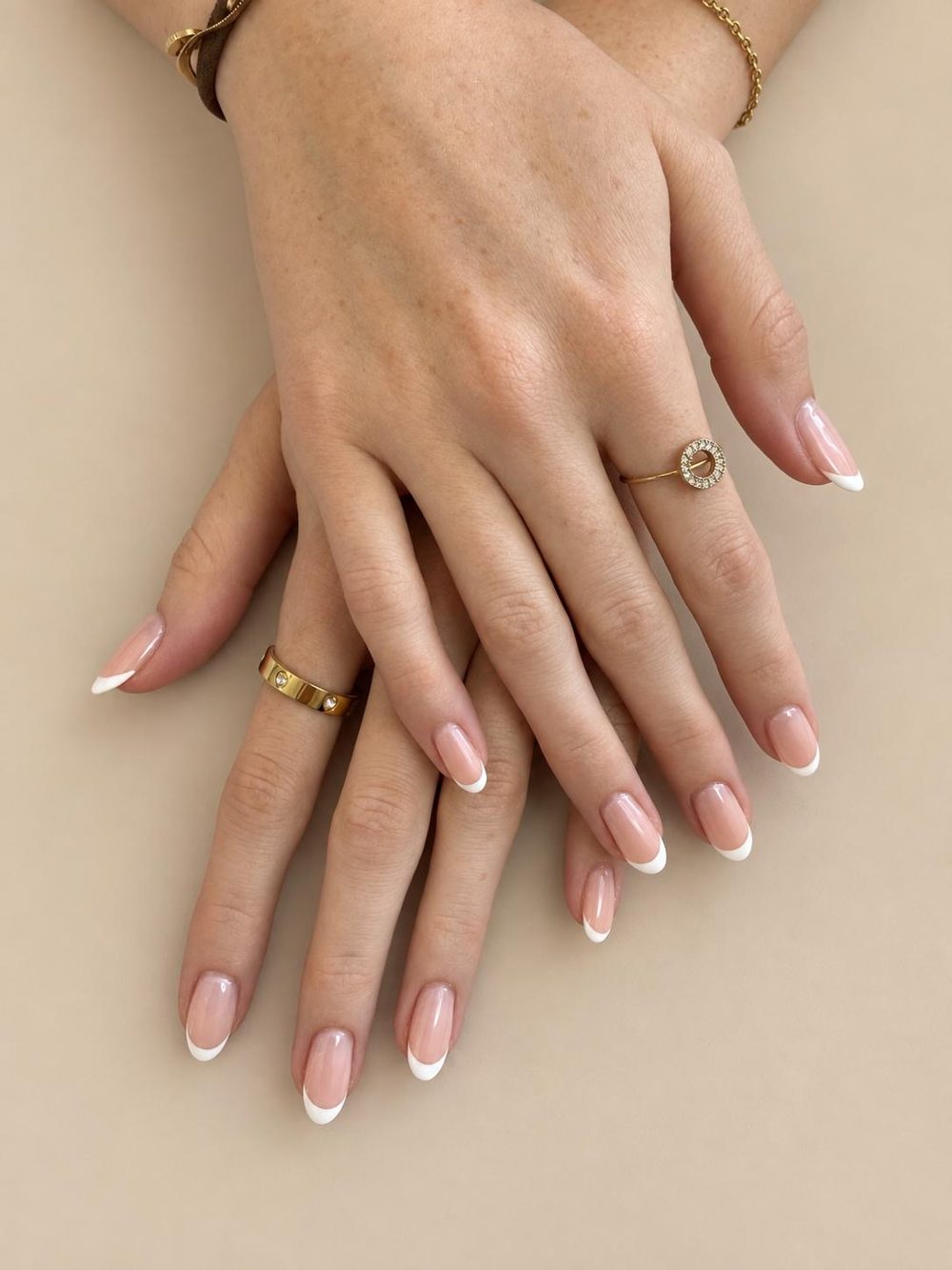 Classic white French tips on almond nails